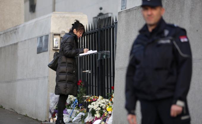 someone paying tribute and a guard