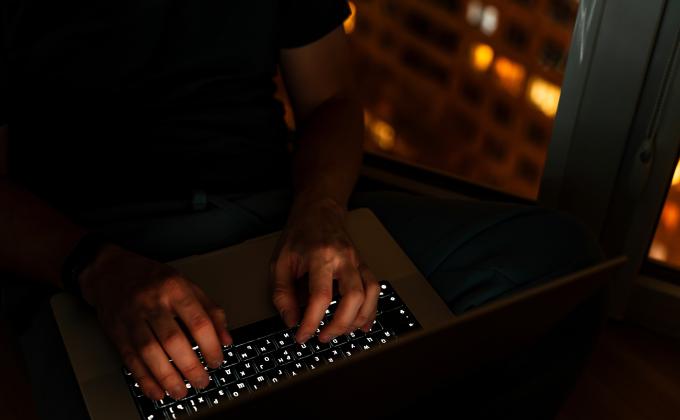 typing on a keyboard in the dark 