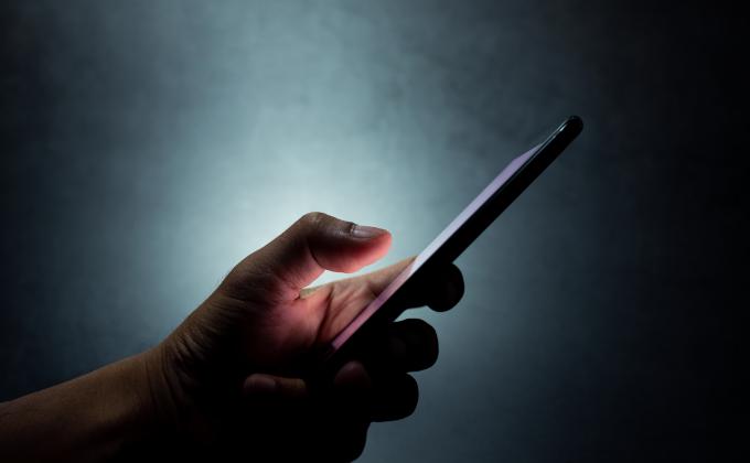 shutterstock 1431658976 hand holding a phone