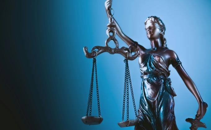 sasun bughdaryan unsplash lady justice blue background