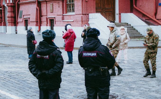 police standing in front of a building with civilians 
